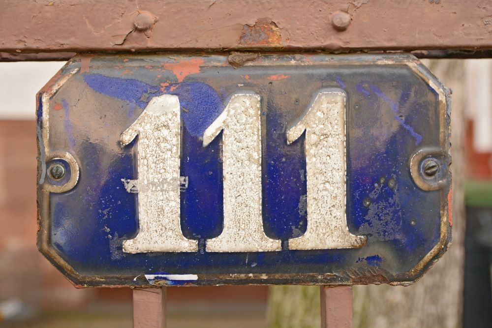 111 Angel Number on a plaque
