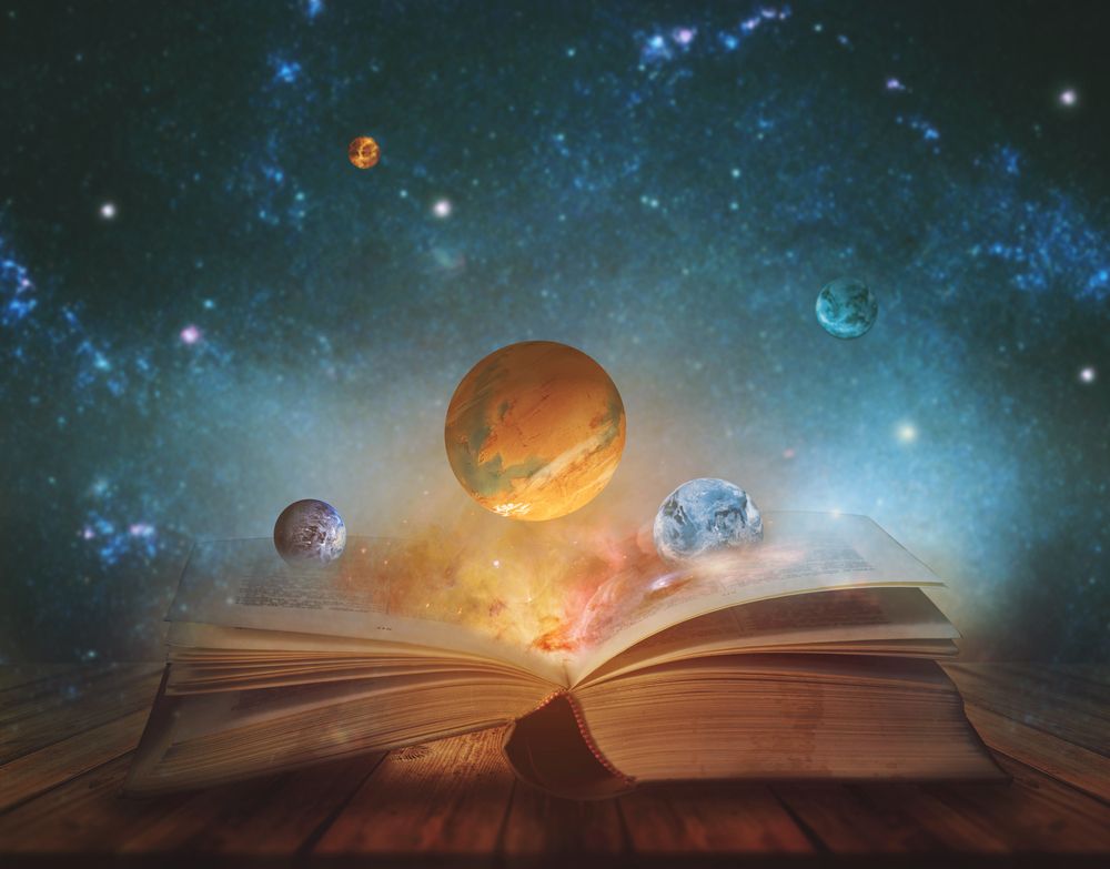 book with planets coming out of it